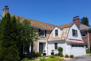 fresh cedar roof and shiny copper garage awning